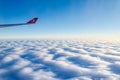 Turkish Airlines Logo on the Right Wing. View from Aircraft Window. Blue Horizon Above the Clouds in Atlantic Ocean. Traveling Fr