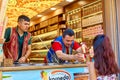 A Turkish animator, an ice cream seller, sells ice cream to a girl hanging over the counter Royalty Free Stock Photo