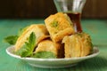 Turkish arabic dessert - baklava with honey and pistachios