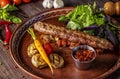 Turkish and Arabic Traditional Ramadan mix kebab plate, Kebab lamb and beef with baked vegetables, mushrooms and tomato sauce,