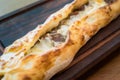 Turkish Bafra Pide with Minced Meat Kavurma Salad and Pickles. Royalty Free Stock Photo