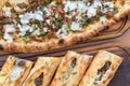 Turkish Bafra Pide with Minced Meat Kavurma Salad and Pickles. Royalty Free Stock Photo