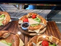 Turkish Bagel Simit Sandwich with Cheese, Tomatoes and Olives at Showcase.
