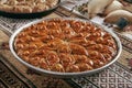 Turkish Baklava in a Round Metal Tray on Vintage Traditional Tablecloth Royalty Free Stock Photo