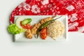 Turkish barbecues Sis Chicken Kebab with rice and salad in a dish isolated on colorful table cloth top view on grey background Royalty Free Stock Photo