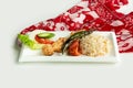 Turkish barbecues Sis Chicken Kebab with rice and salad in a dish isolated on colorful table cloth top view on grey background Royalty Free Stock Photo