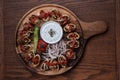 Turkish Beyti kebab served with grilled vegetables and yoghurt sauce on wooden table