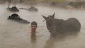 Turkish boy and his horse in thermal water, Guroymak, Bitlis Royalty Free Stock Photo