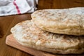 Turkish Bread Bazlama on wooden surface. Royalty Free Stock Photo