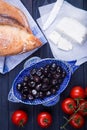 Turkish breakfast with black olives, bread, panir cheese and cherry tomatoes