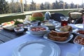 Traditional Turkish family breakfast table and people taking various food. Royalty Free Stock Photo