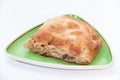 Turkish burek with meat on a green plate Royalty Free Stock Photo