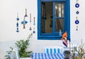 Turkish cafe in mediterranean greek style with a blue window and a table for dinner, decorated with beautiful Turkish Royalty Free Stock Photo