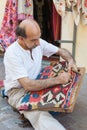 Turkish carpet master repearing old traditional turkish carpet