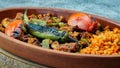 Turkish chicken Kebab called Mudurnu Kebab, garnished with vegetables, bulgur pilaf served on ceramic dish - Turkish,  Food Kebab Royalty Free Stock Photo