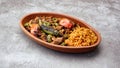 Turkish chicken Kebab called Mudurnu Kebab,garnished with vegetables, bulgur pilaf served on ceramic dish - Turkish,  Food Kebab Royalty Free Stock Photo