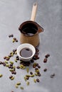 Turkish Coffee with coffee beans and Cardamom scattered on a vintage background Royalty Free Stock Photo