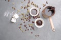 Turkish Coffee with coffee beans and Cardamom scattered on a vintage background Royalty Free Stock Photo