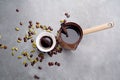 Turkish Coffee with coffee beans and Cardamom scattered on a vintage background Royalty Free Stock Photo
