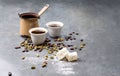 Turkish Coffee with coffee beans and Cardamom scattered on a vintage background Royalty Free Stock Photo