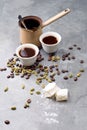 Turkish Coffee with coffee beans and Cardamom scattered on a vintage background Royalty Free Stock Photo