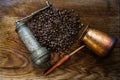 Turkish coffee concept. Copper coffee pot Cezve, vintage coffee grinder, cup, coffee beans on a dark wooden background. Top view Royalty Free Stock Photo