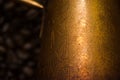 Turkish coffee concept. Copper coffee pot Cezve, vintage coffee grinder, cup, coffee beans on a dark wooden background. Top view Royalty Free Stock Photo