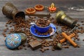 Turkish coffee concept. Copper pot (Cezve), vintage coffee grinder, coffee beans on a dark wooden background. Royalty Free Stock Photo