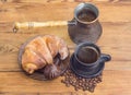 Turkish coffee, copper coffee pot, croissant and chocolate truffle Royalty Free Stock Photo