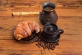 Turkish coffee, copper coffee pot, croissant on rustic table Royalty Free Stock Photo