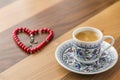 Turkish coffee with heart shaped red rosary