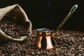 A Turkish coffee pot with beans Royalty Free Stock Photo