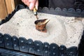 Turkish coffee prepared on hot sand for an unique taste and aroma Royalty Free Stock Photo