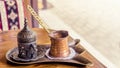 Turkish coffee with traditional embossed metal tray and cup Royalty Free Stock Photo