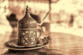 Turkish coffee with traditional embossed metal tray and cup. Toned Royalty Free Stock Photo