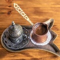 Turkish coffee with traditional embossed metal tray and cup. Top view Royalty Free Stock Photo