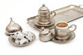 Turkish coffee in traditional silver cup with Turkish delight on isolated white background Royalty Free Stock Photo