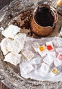 Turkish coffee and Turkish sweets over dark wooden background Royalty Free Stock Photo