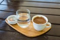 Turkish coffee on the wood with glass of water and turkish delights Royalty Free Stock Photo