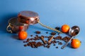 Turkish copper dishes with coffee beans and tangerines