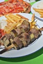 Beef eggplant meat skewer French fries barbeque grill Royalty Free Stock Photo
