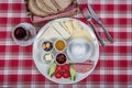 Turkish Cuisine Breakfast Plate. White breakfast plate with sliced cherry tomatoes, cucumber and boiled egg with on wooden table Royalty Free Stock Photo