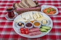 Turkish Cuisine Breakfast Plate. White breakfast plate with sliced cherry tomatoes, cucumber and boiled egg with on wooden table Royalty Free Stock Photo