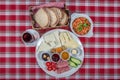 Turkish Cuisine Breakfast Plate. White breakfast plate with sliced cherry tomatoes, cucumber and boiled egg with on wooden table Royalty Free Stock Photo