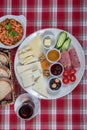 Turkish Cuisine Breakfast Plate. White breakfast plate with sliced cherry tomatoes, cucumber and boiled egg with on wooden table Royalty Free Stock Photo