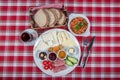 Turkish Cuisine Breakfast Plate. White breakfast plate with sliced cherry tomatoes, cucumber and boiled egg with on wooden table Royalty Free Stock Photo