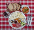 Turkish Cuisine Breakfast Plate. White breakfast plate with sliced cherry tomatoes, cucumber and boiled egg with on wooden table Royalty Free Stock Photo