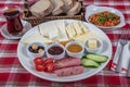 Turkish Cuisine Breakfast Plate. White breakfast plate with sliced cherry tomatoes, cucumber and boiled egg with on wooden table Royalty Free Stock Photo