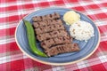 Turkish cuisine inegol meatballs. Grilled meatballs on a plate. Turkish Tekirdag or inegol Kofte with pepper, rice and mashed