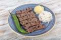 Turkish cuisine inegol meatballs. Grilled meatballs on a plate. Turkish Tekirdag or inegol Kofte with pepper, rice and mashed